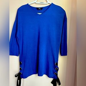 Beautiful never worn blue blouse with side detail.
